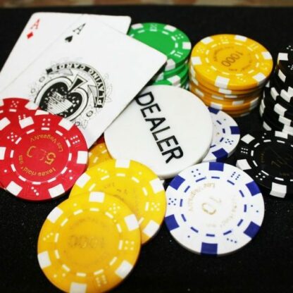 poker chips and dealer buttons