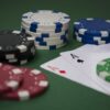 poker hand with chips and cards
